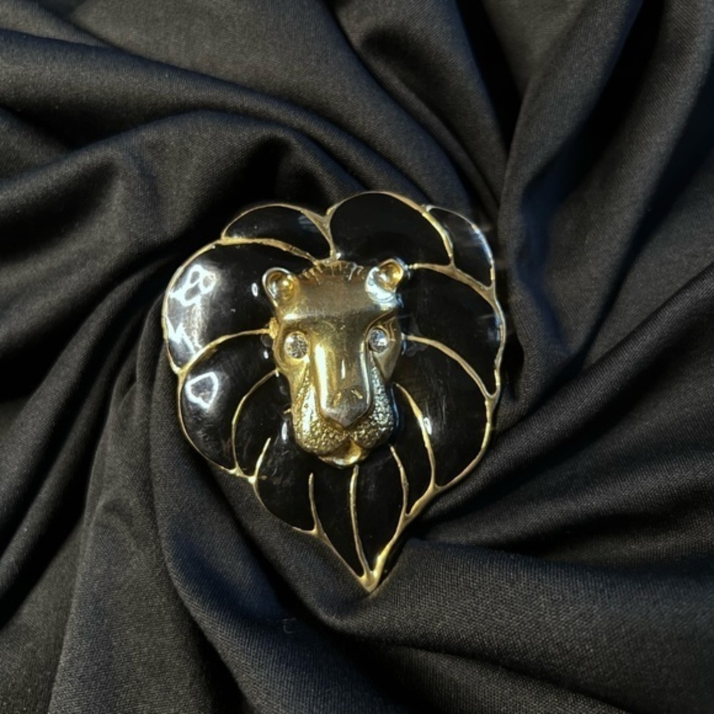 Vintage gold tone and black lion brooch